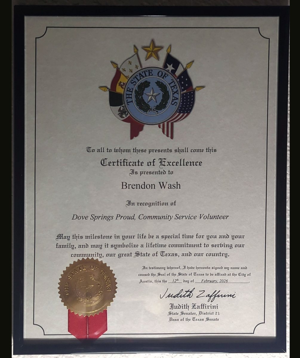 A framed Certificate of Excellence from the State of Texas presented to Brendon Wash in recognition of Dove Springs Proud community service, signed by State Senator Judith Zaffirini and dated February 2026.